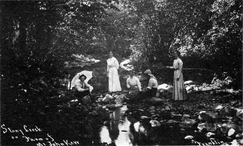 Kerr family members and friends relax by the Stoney&nbsp;Creek, c1906. John Lindsay Kerr, second owner of Robert Kerr's house, is seated to the right.