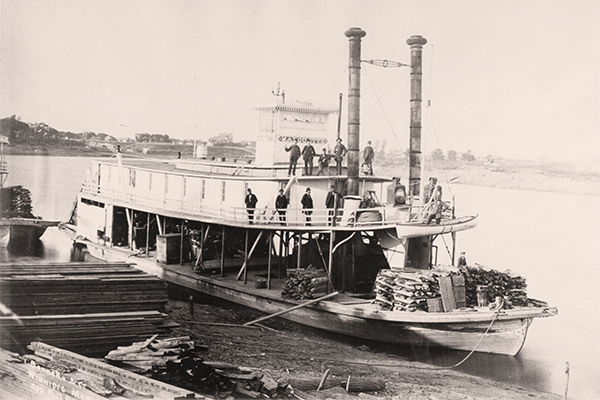 Wood was an essential resource for the steamboats that plied Manitoba waters from the 1850s to the early 20th century. In this view byWinnipeg photographer Israel Bennetto taken around 1883, the Marquette is standing at anchor, loaded with firewood to fuel its boilers.Built in 1881 for Peter MacArthur&rsquo;s Northwest Navigation Company, the Marquette saw service on the Red and Assiniboine rivers.
