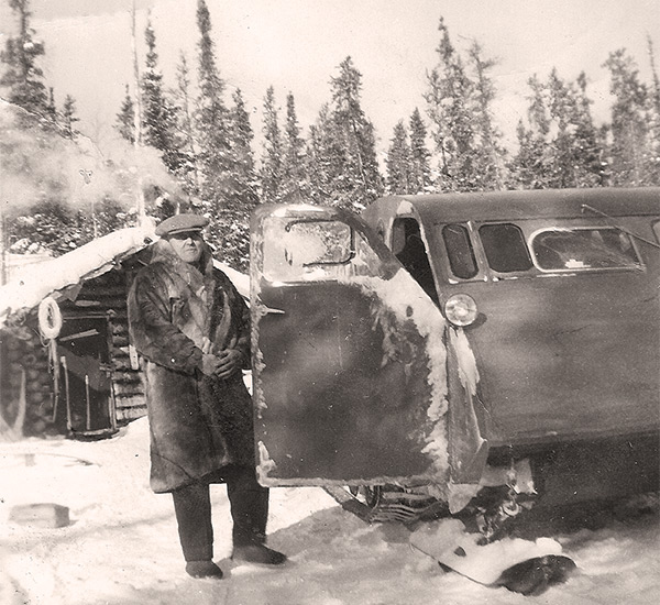 Game warden Jim Cumines (1879&ndash;1961) on winter patrol by bombardier, 1942.