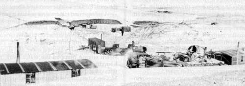 A 1933 photograph depicting the George Cain coal mine at left and across the fence the Nestibo mine