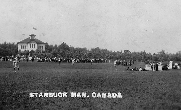 A buccolic day on the baseball field outside Starbuck Consolidated School is the theme of this postcard from the 1920s.