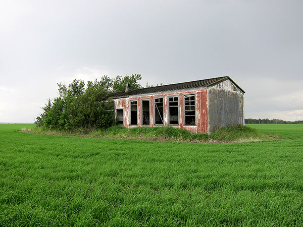 The metal-clad Duck Mountain School in the RM of Grandview had two classrooms, indoor washrooms, and a forced-air furnace.