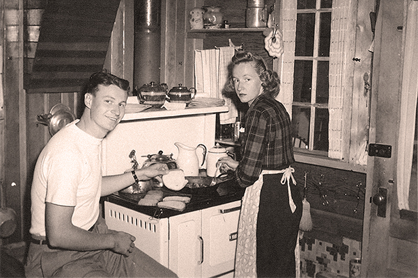 Beech family kitchen with wood-burning stove, 1940s.