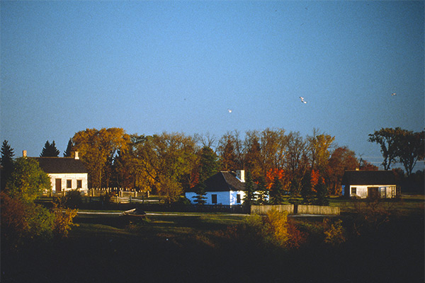 Lower Fort Garry National Historic Site, 1994. The buildings, left to right, include the Farm Manager’s Cottage that was moved to the site in 1970, the restored Ross Cottage, and the reconstructed Blacksmith Shop.