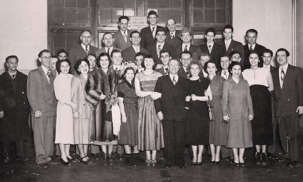 A group believed to be alumni of the Jewish Orphanage celebrating the 80th birthday of David Spivak.