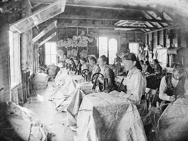 Seamstresses inside Hope's tent factory