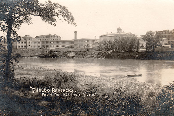 Postcard view of the Fort Osborne Barracks from the north side of the Assiniboine River