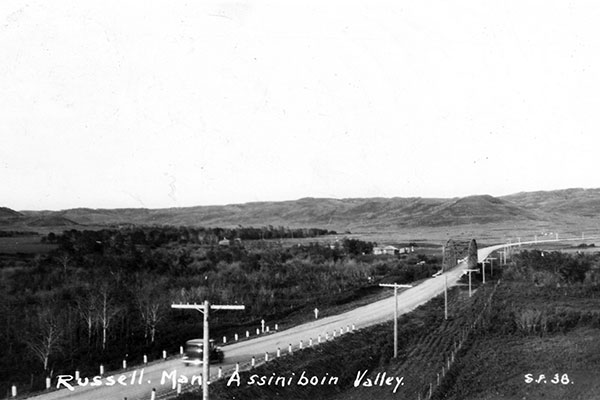 Postcard view of steel through truss bridge over the Assiniboine River