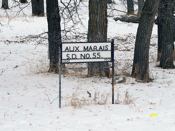 Aux Marais School commemorative sign