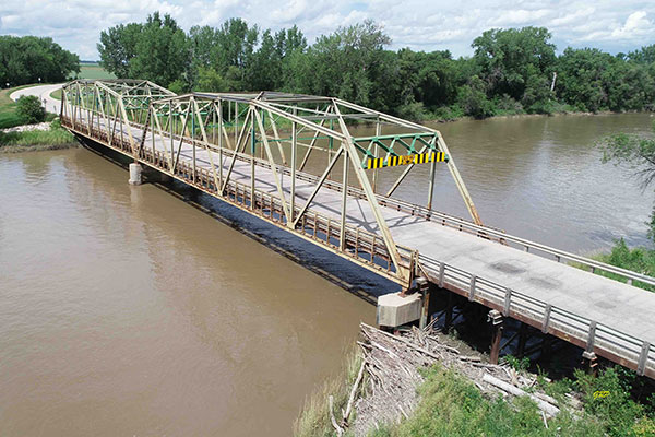 Aerial view of steel through truss bridge over the Assiniboine River at Baie St. Paul