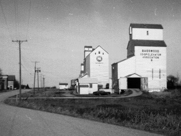 The former Manitoba Pool grain elevators B at right and A at centre at Basswood