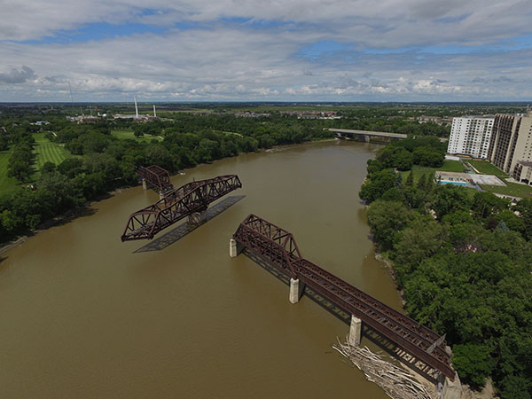 Aerial view of the Canadian Pacific Railway Bergen Cutoff Bridge with the Kildonan Settlers Bridge in the background