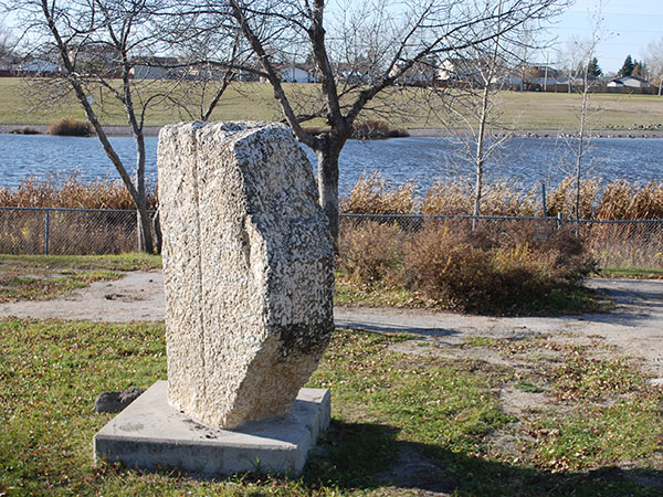 Billy Hughes Commemorative Monument with lake in background