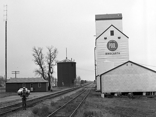 Canadian Pacific Railway water tower at left and Manitoba Pool grain elevator at right