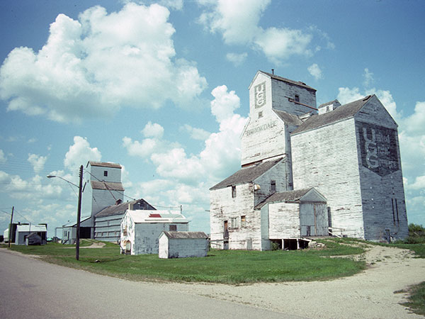 United Grain Growers grain elevator at Brookdale, with the Manitoba Pool elevator in the background
