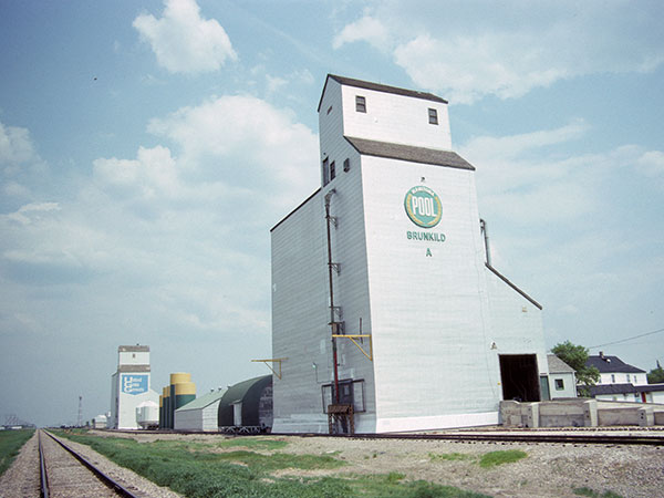 Manitoba Pool grain elevator with the United Grain Growers grain elevator in the background