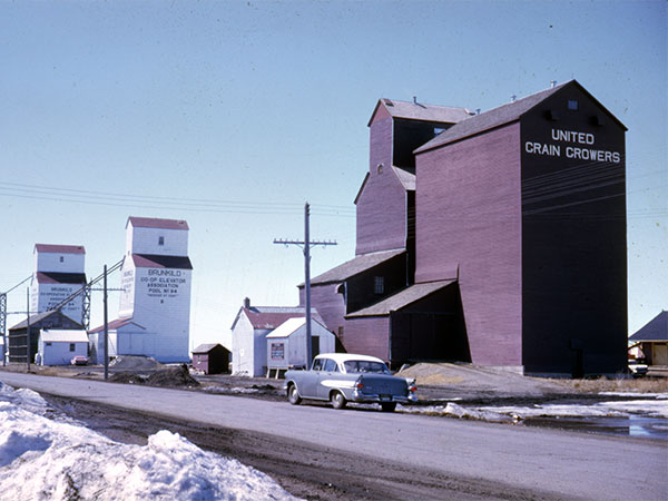 United Grain Growers grain elevator with Manitoba Pool grain elevators in the background
