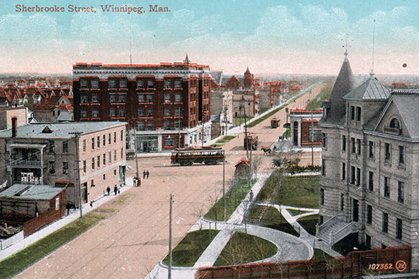 A view from the top of Fire Hall No. 5, with the Manitoba Deaf and Dumb Institute at right and the Casa Loma Building in the background, behind the streetcar