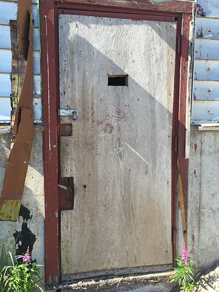 Entrance to the former L9 Building with bear inspection hole