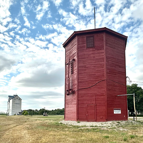 Clearwater railway water tower with grain elevator in the background