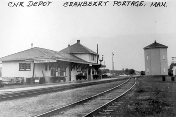 Canadian National Railway Station at left and Canadian National Railway Water Tower at right at Cranberry Portage