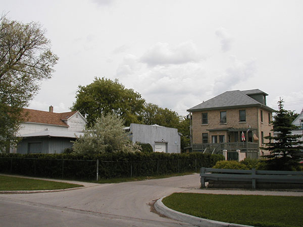 Machine shop and garage of the former Constant macaroni factory at left and Constant family home at right