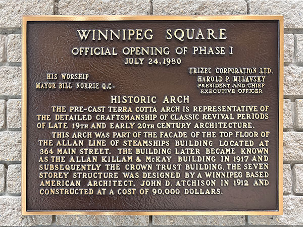 Plaque beside terra cotta arch from the Crown Trust Building in Winnipeg Square