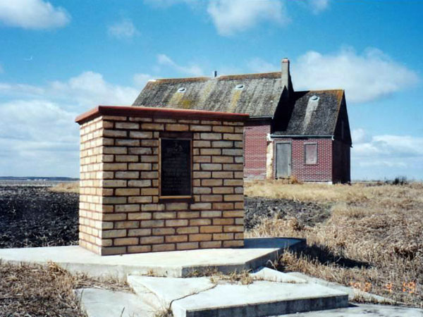 The former Cypress Valley School building and commemorative monument