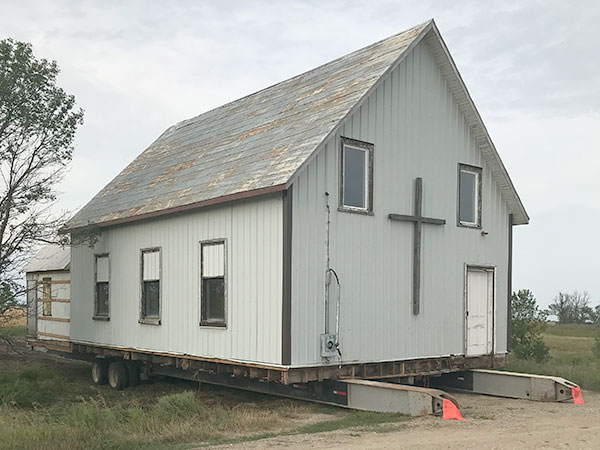 The former Dand United Church in preparation for being moved