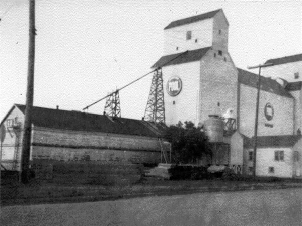 Manitoba Pool grain elevator B at left, with the Pool A elevator and annex at right