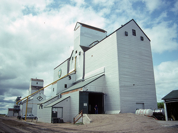 Manitoba Pool grain elevator, with a Paterson Grain elevator in the background, at Dufrost