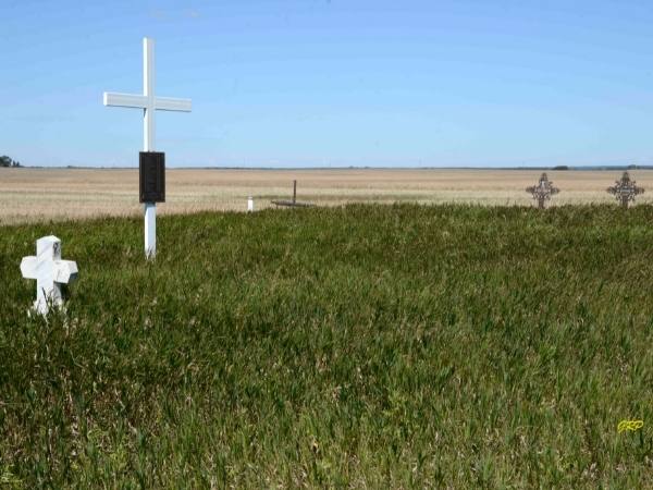 Crosses on the prairie at the Dunrea Old Roman Catholic Cemetery