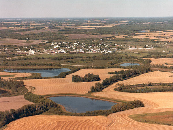 Aerial view of Elphinstone with grain elevator at left