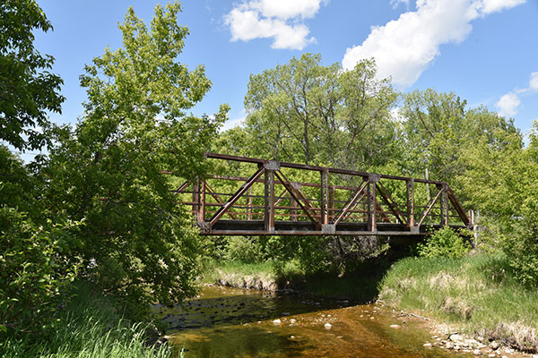 Steel pony truss bridge over the Fork River