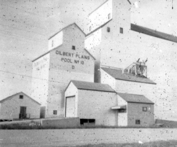 The old and new Manitoba Pool D grain elevators at Gilbert Plains