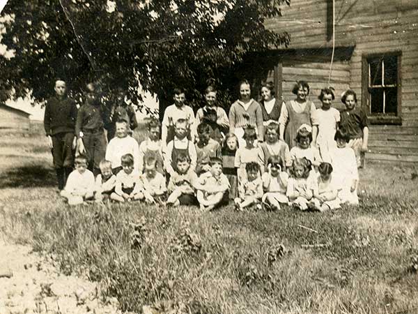 Students by the original Glencove School building