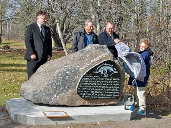 Greenridge School commemorative monument unveiled by (L-R) Ross Metcalfe (Superintendent, Interlake School Division), Terry Hartle (RM of Rockwood), Ralph Eichler (MLA, Lakeside), and Catherine Thexton