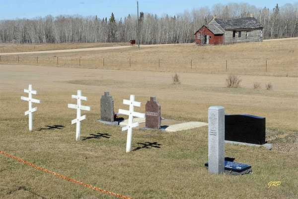 Halicz Ukrainian Orthodox Cemetery with the Halicz Hall in the background