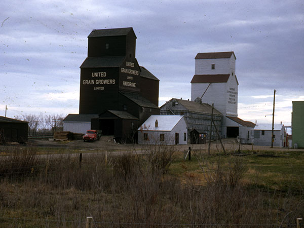 United Grain Growers grain elevator at Hargrave, with the Manitoba Pool grain elevator in the background