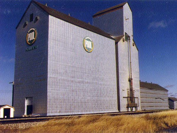Manitoba Pool grain elevator with crib annex (left) and Overgaard annex (right) at Holland