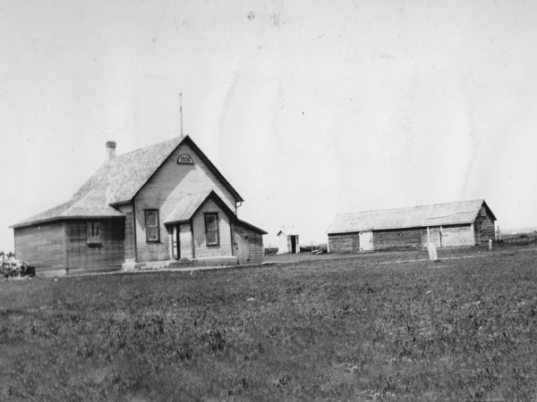 Iroquois School (built 1906) and horse barn