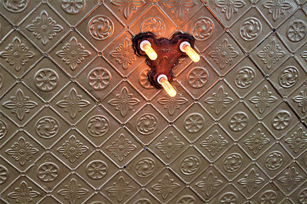 Original tin ceiling tiles salvaged during renovations of the Langside Grocery restaurant