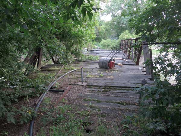 Abandoned steel pony truss bridge over the Whitemud River