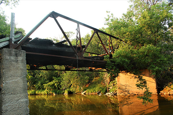 Abandoned steel pony truss bridge over the Whitemud River