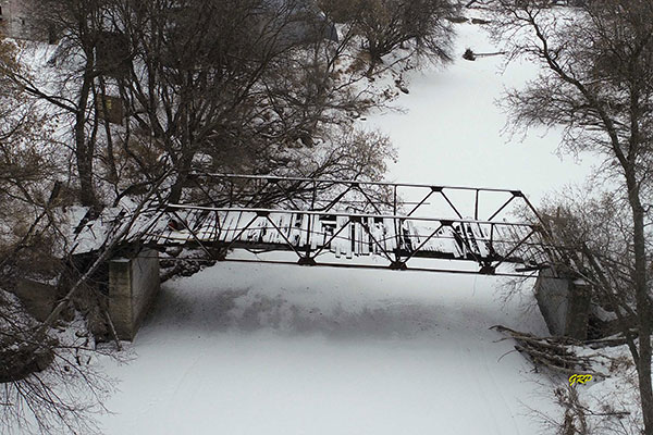 Abandoned steel pony truss bridge over the Whitemud River