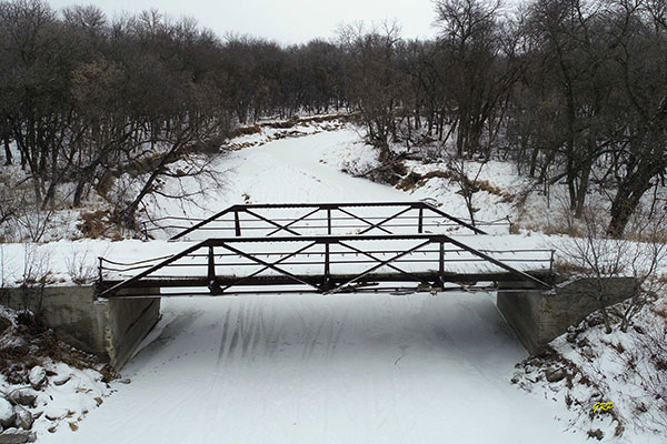 Steel pony truss bridge over the Whitemud River