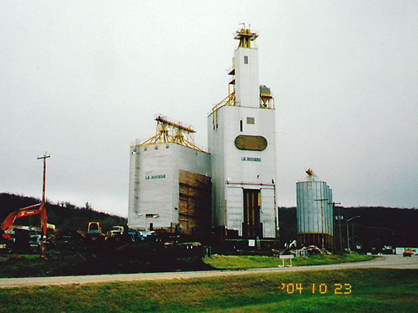 Manitoba Pool grain elevator at La Riviere being prepared for transport