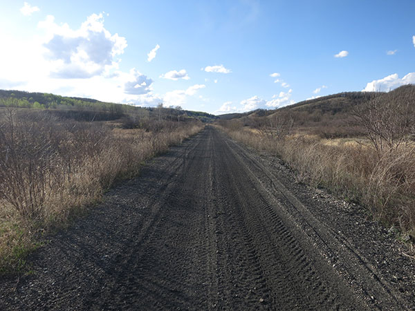 The abandoned rail line that once brought skiers to the site, now used by all-terrain recreational vehicles