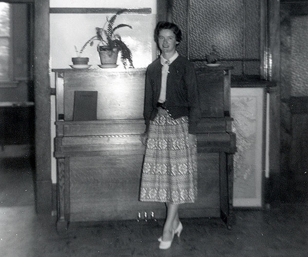 Teacher P. Holman in the Assembly room on the top floor of Lord Roberts School No. 1