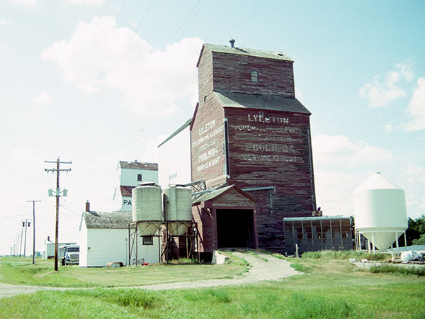 Manitoba Pool grain elevator at Lyleton with Paterson grain elevator in the background